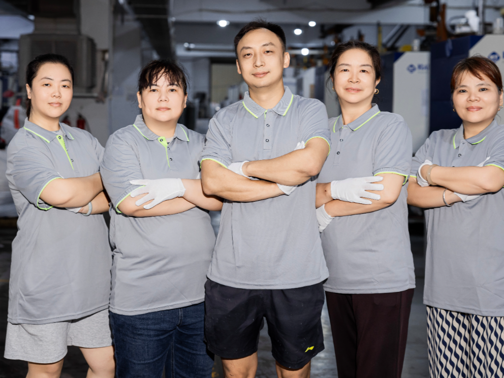 A group photo of the R&D team in uniform.